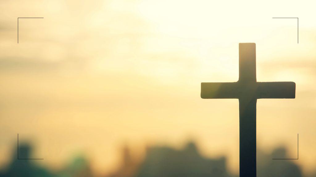 silhouette of a cross against a golden sunset - prayer points for the church at Church Ministry Help