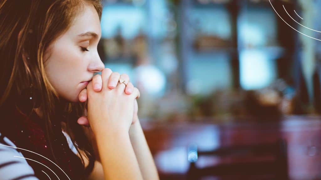 Prayer points for church service - picture of a women praying in a church