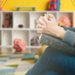 3 - woman praying in a children's room - prayer for VBS