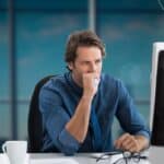 3 - man stressed in front of a computer - - Bible verses for stress and hard times
