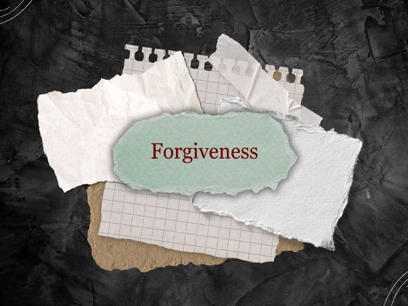 forgiveness written on a stack of ripped sheets of paper - Bible verses about forgiving